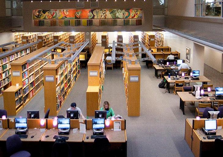 Library student spaces - side view of study tables and library