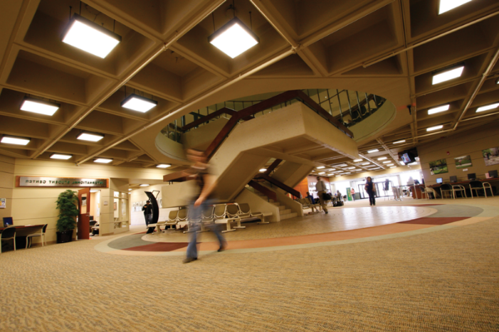 student walking in Student Center lobby